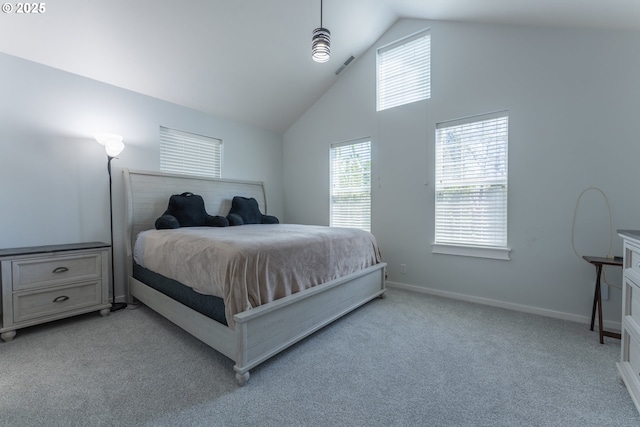 bedroom featuring high vaulted ceiling, baseboards, visible vents, and light colored carpet