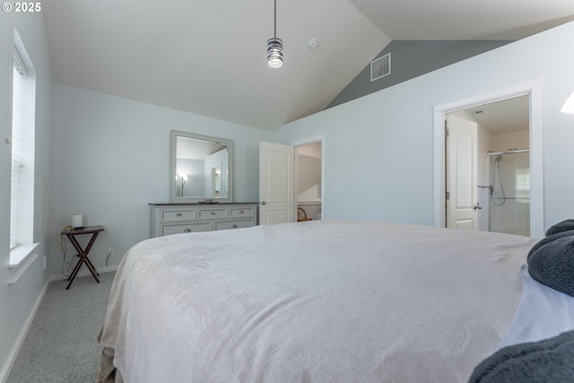 carpeted bedroom featuring lofted ceiling, baseboards, and visible vents
