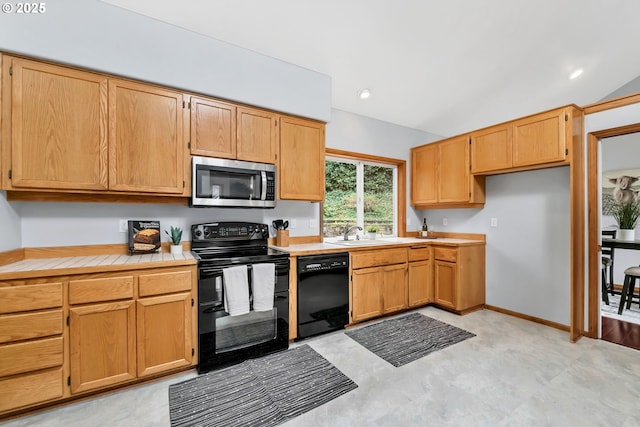3870 Ashford Dr, Eugene, OR 97405 - kitchen featuring black appliances, a sink, tile countertops, and light flooring