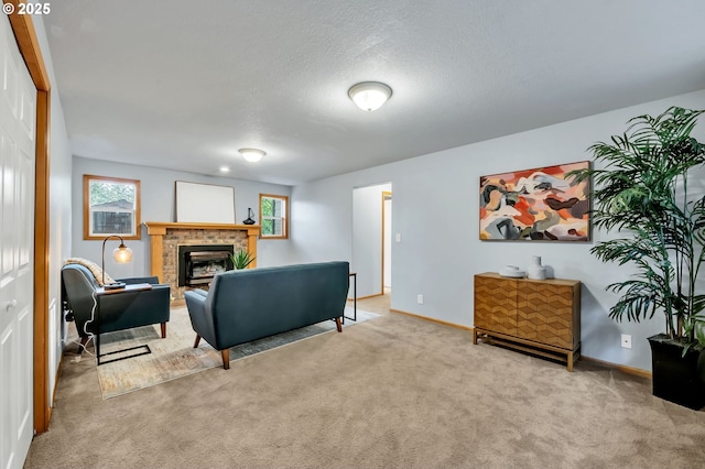 3870 Ashford Dr, Eugene, OR 97405 - carpeted living room featuring a tiled fireplace, baseboards, and a textured ceiling