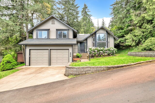 3870 Ashford Dr, Eugene, OR 97405 - tri-level home featuring a garage, concrete driveway, a front lawn, and a shingled roof