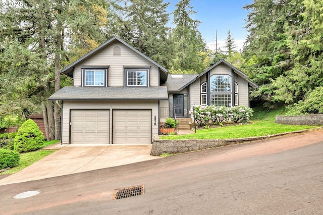 3870 Ashford Dr, Eugene, OR 97405 - tri-level home with an attached garage, concrete driveway, roof with shingles, and a front yard