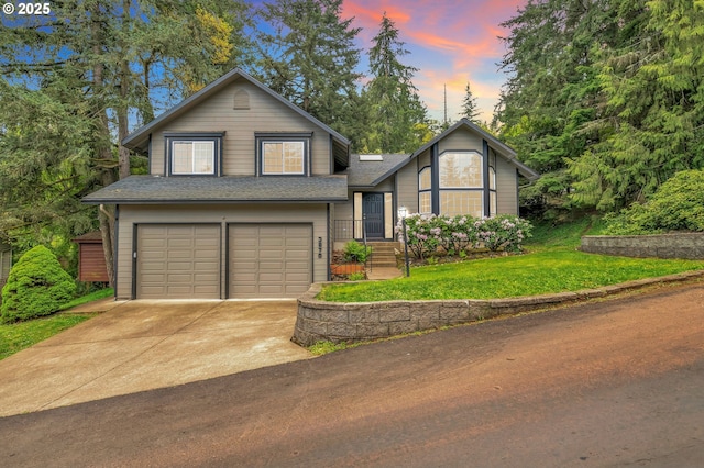 3870 Ashford Dr, Eugene, OR 97405 - view of front of house with a garage, a yard, roof with shingles, and concrete driveway