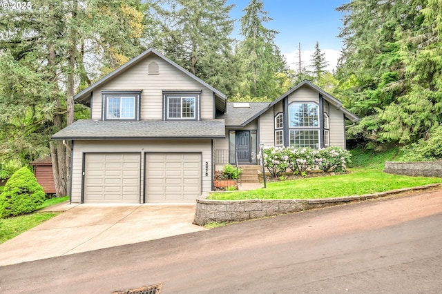 3870 Ashford Dr, Eugene, OR 97405 - tri-level home featuring a garage, driveway, roof with shingles, and a front lawn
