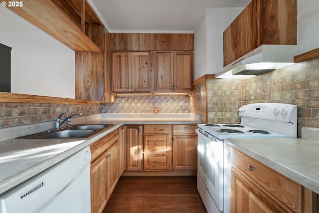 kitchen with sink, white appliances, tasteful backsplash, and dark hardwood / wood-style floors