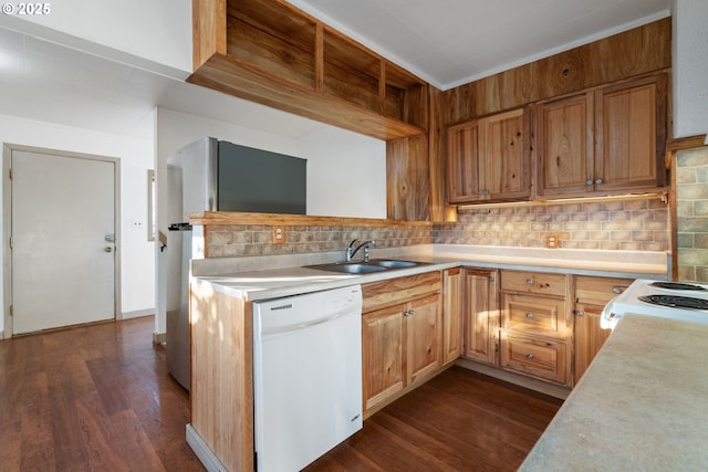 kitchen featuring white appliances, dark hardwood / wood-style flooring, sink, and decorative backsplash