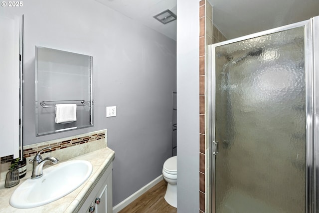 4460 SW Scholls Ferry Rd Unit 5, Portland, OR 97225 - bathroom with vanity, wood finished floors, a stall shower, and backsplash