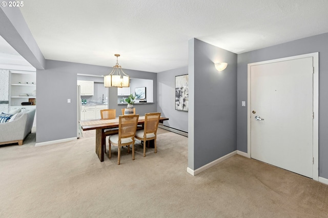 4460 SW Scholls Ferry Rd Unit 5, Portland, OR 97225 - dining room featuring light colored carpet, baseboard heating, and a chandelier