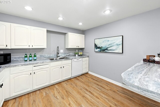 4460 SW Scholls Ferry Rd Unit 5, Portland, OR 97225 - kitchen featuring white dishwasher, black microwave, light wood-style floors, white cabinets, and recessed lighting
