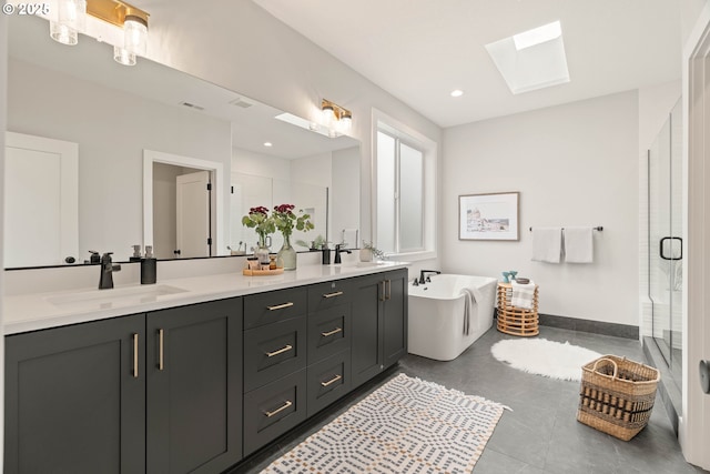 2915 NW 114th Ter, Portland, OR 97229 - bathroom featuring a skylight, a shower stall, double vanity, and a freestanding tub