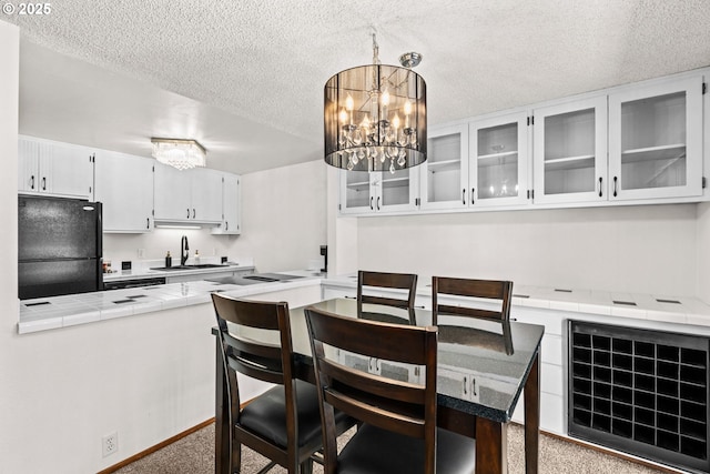 2547 Brittania Pl, Eugene, OR 97405 - carpeted dining room with a textured ceiling, a chandelier, and heating unit