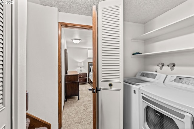 2547 Brittania Pl, Eugene, OR 97405 - washroom featuring a textured ceiling, washer and dryer, and light colored carpet