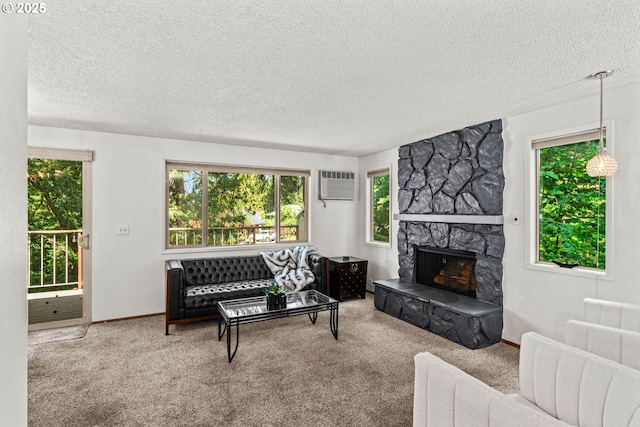 2547 Brittania Pl, Eugene, OR 97405 - living area featuring a textured ceiling, plenty of natural light, a stone fireplace, and carpet floors