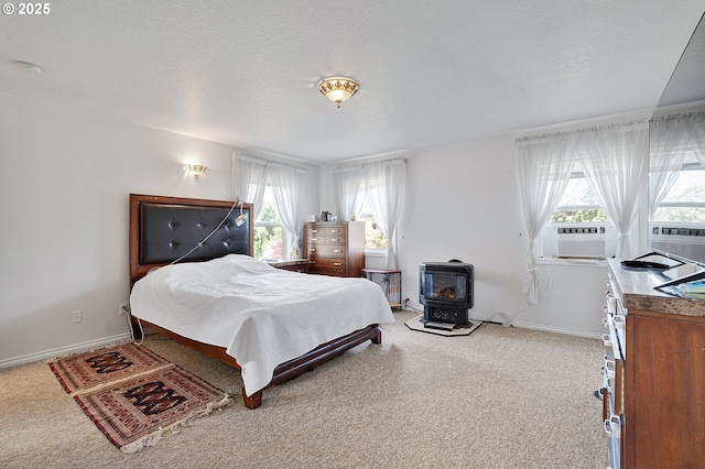 8670 SW Indian Hill Ln, Beaverton, OR 97008 - bedroom with a wood stove, cooling unit, light colored carpet, multiple windows, and a textured ceiling