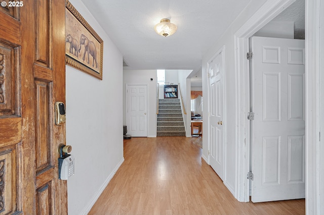 8670 SW Indian Hill Ln, Beaverton, OR 97008 - hallway with light wood-type flooring and stairs