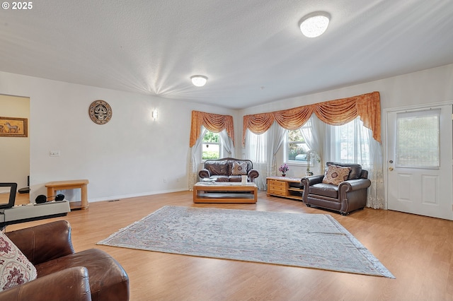 8670 SW Indian Hill Ln, Beaverton, OR 97008 - living area featuring light wood-style flooring and a textured ceiling