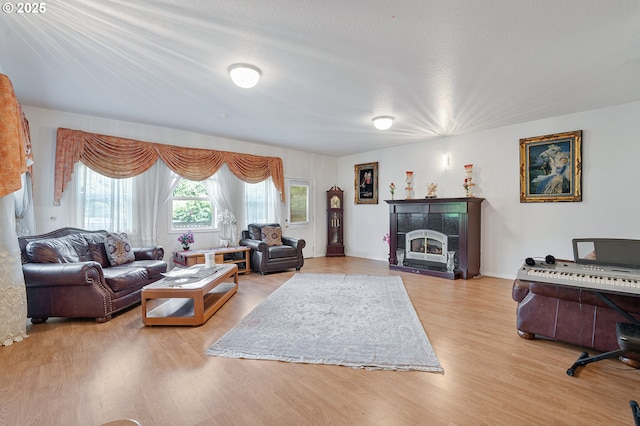 8670 SW Indian Hill Ln, Beaverton, OR 97008 - living room with wood finished floors and a tiled fireplace