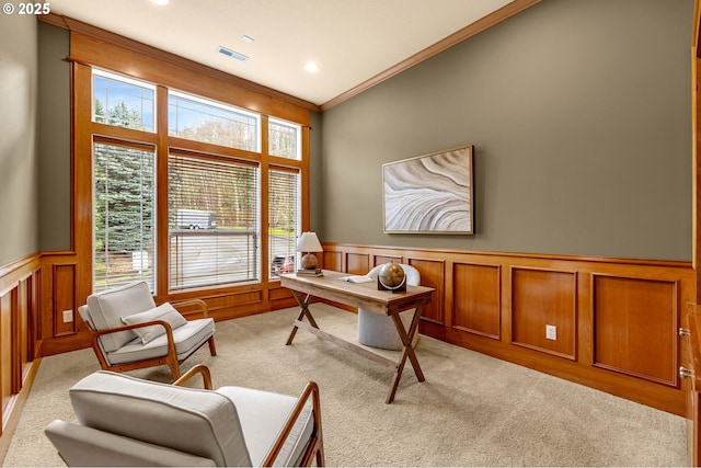 office featuring visible vents, light colored carpet, a wainscoted wall, crown molding, and recessed lighting