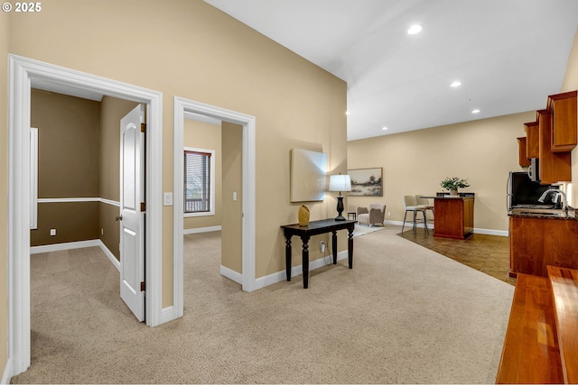 corridor with carpet floors, baseboards, and recessed lighting