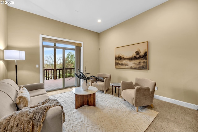 living area with carpet, baseboards, and recessed lighting