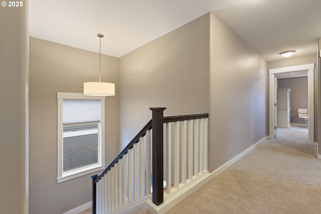 hallway with light carpet