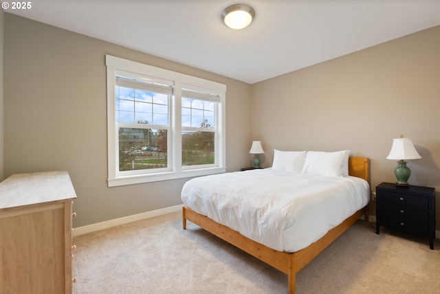 bedroom with light carpet