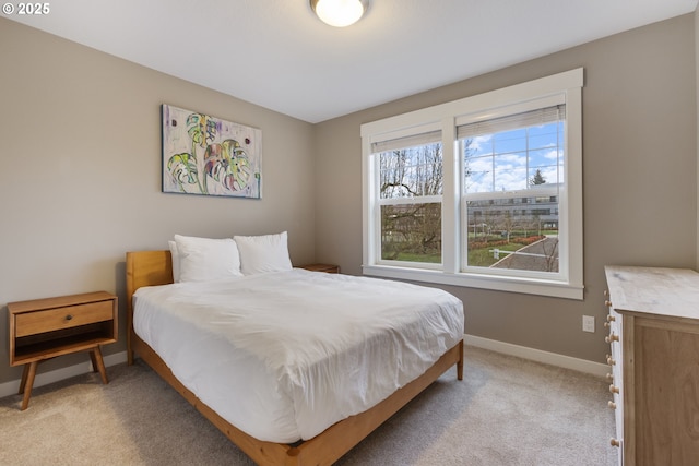 bedroom featuring light colored carpet