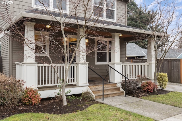 entrance to property featuring a porch