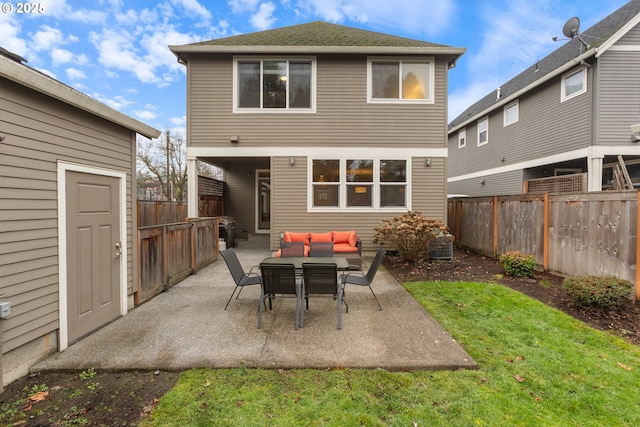 back of property featuring a patio area, outdoor lounge area, and a yard