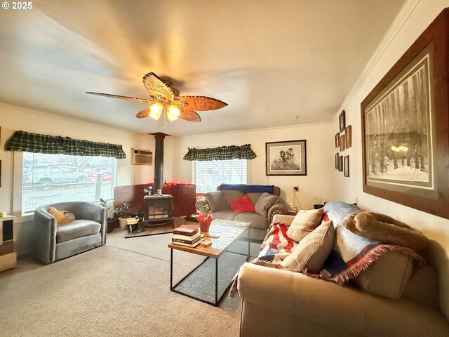 carpeted living room with ceiling fan, ornamental molding, a wall unit AC, and a wood stove