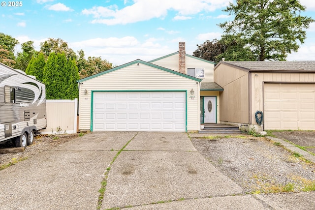 2653 SW 18th Pl, Gresham, OR 97080 - mid-century inspired home with roof with shingles, a chimney, fence, driveway, and a garage