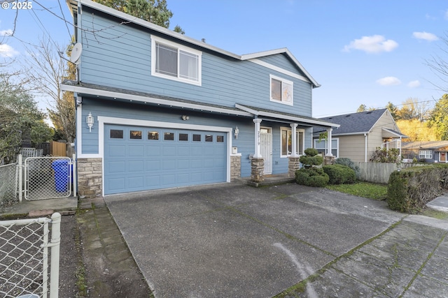 view of front of property with a garage, stone siding, aphalt driveway, and fence