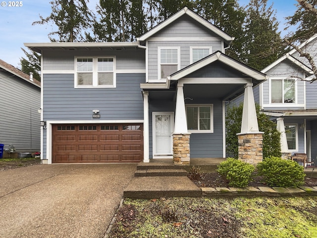 craftsman-style house featuring a porch and a garage