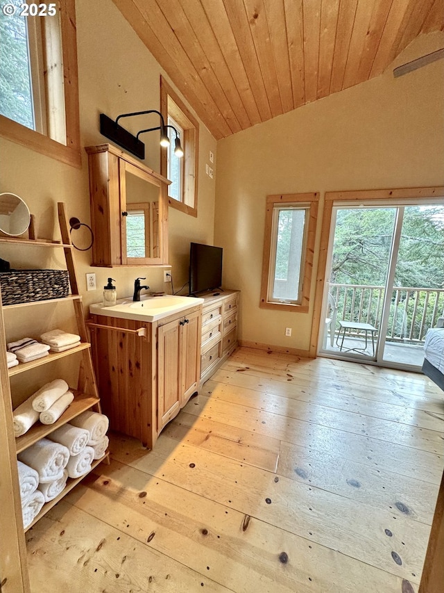 bathroom featuring vanity, lofted ceiling, hardwood / wood-style floors, and wood ceiling