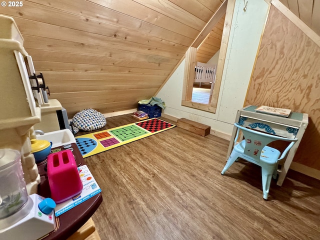 playroom with lofted ceiling, hardwood / wood-style floors, wooden walls, and wooden ceiling