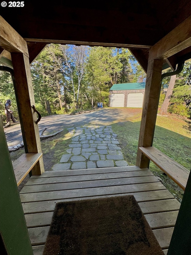 exterior space with an outbuilding and a garage