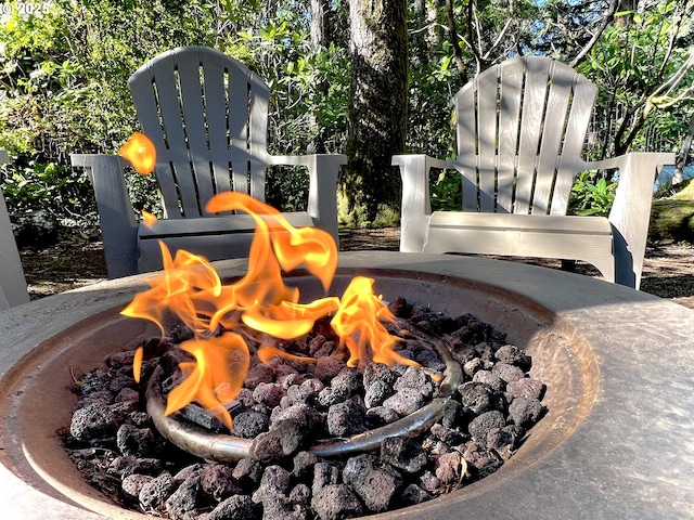 exterior details with an outdoor fire pit