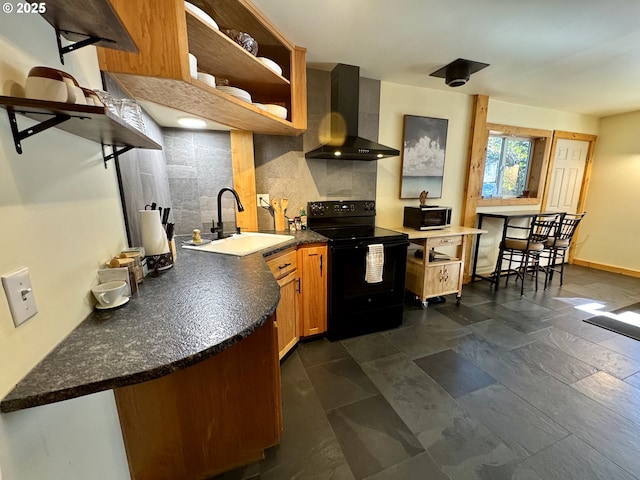 kitchen featuring black electric range oven, sink, kitchen peninsula, decorative backsplash, and wall chimney range hood