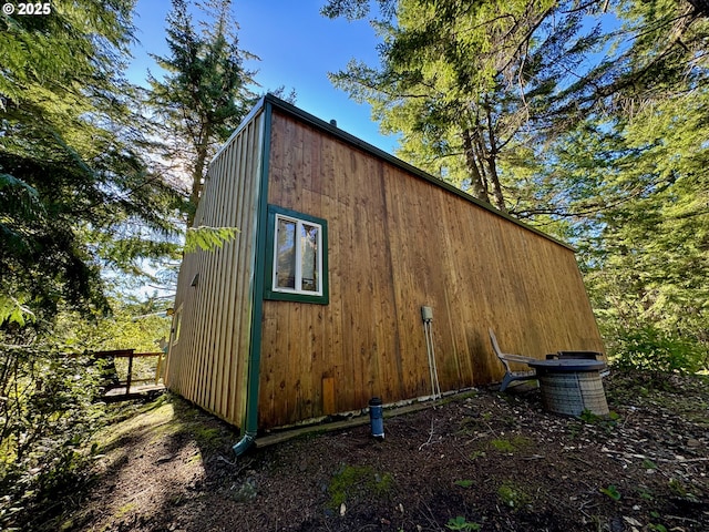 view of side of property with central air condition unit