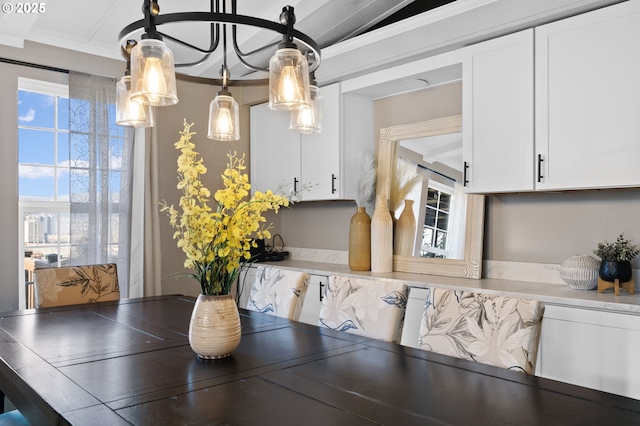 dining area featuring ornamental molding