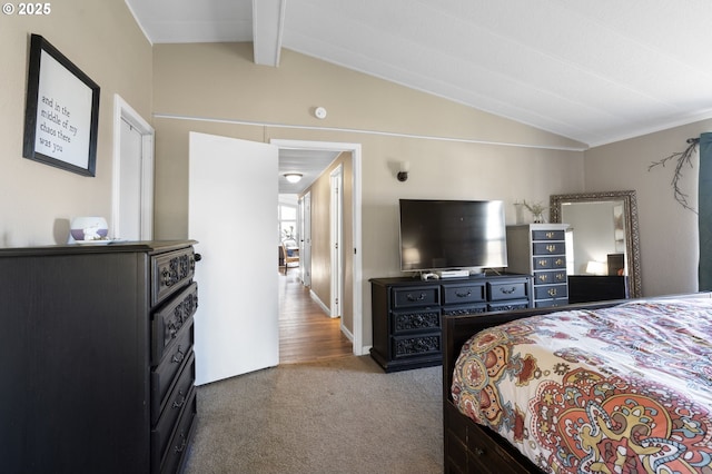 bedroom with lofted ceiling with beams and carpet