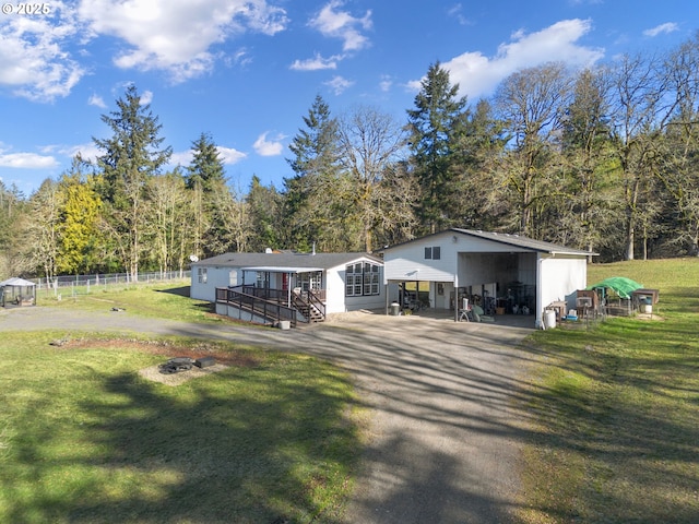 view of front of house featuring a front yard and a carport