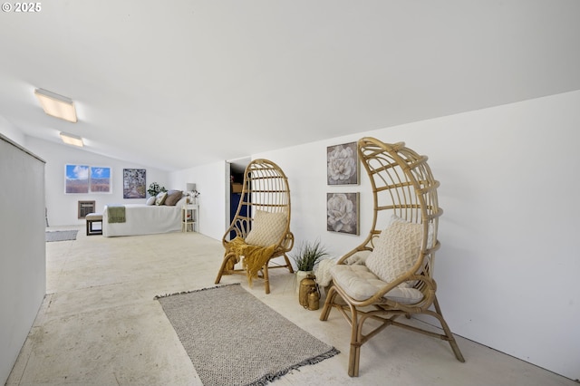 living area featuring vaulted ceiling