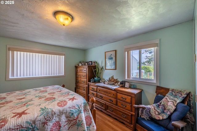 bedroom featuring wood finished floors