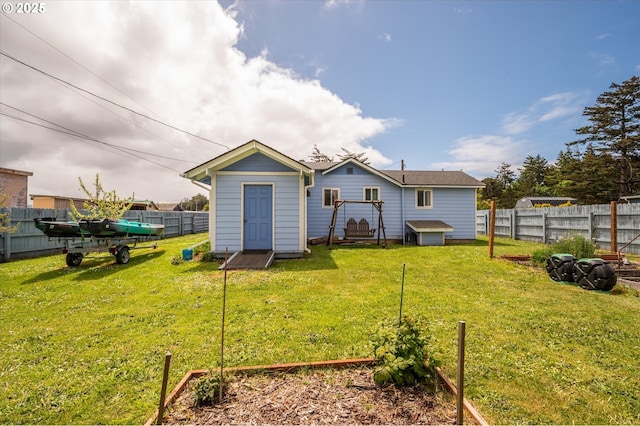 back of property featuring a storage shed and an outdoor structure