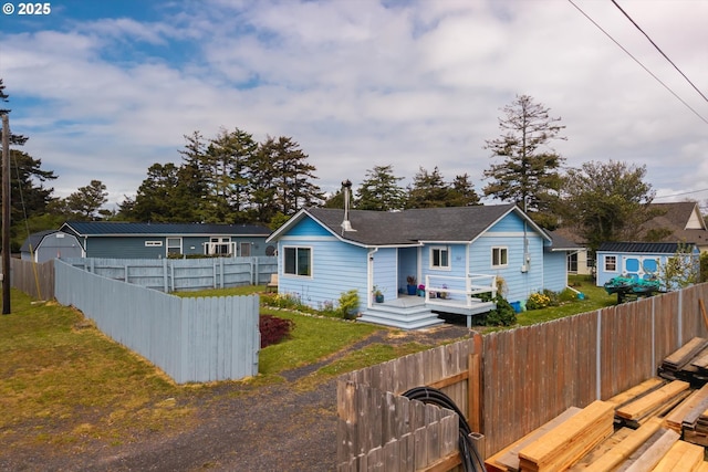 view of front of house with a wooden deck and a shingled roof