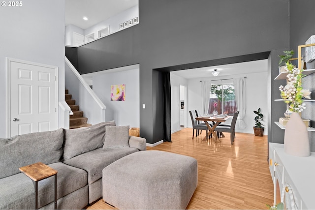 42015 NW Buckshire St, Banks, OR 97106 - living room with stairway, light wood-type flooring, and a towering ceiling