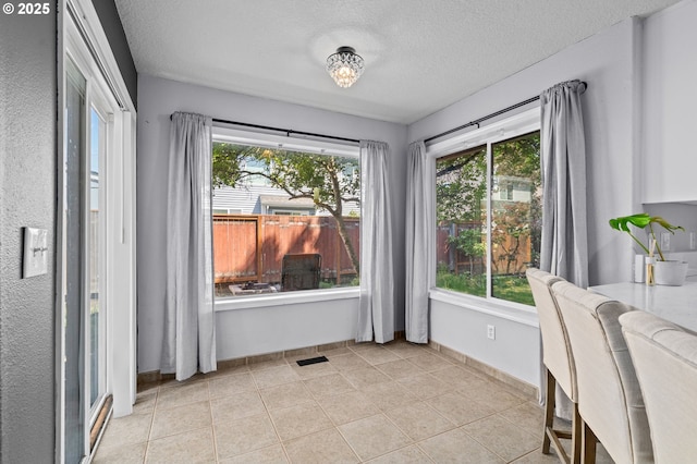 42015 NW Buckshire St, Banks, OR 97106 - dining space with visible vents, a textured ceiling, and light tile patterned flooring