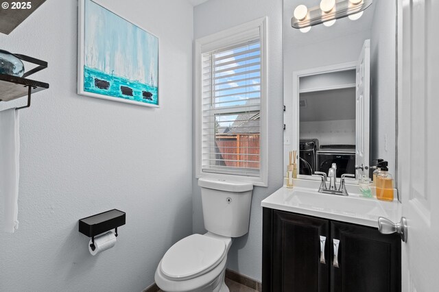 42015 NW Buckshire St, Banks, OR 97106 - half bathroom featuring vanity, separate washer and dryer, and toilet