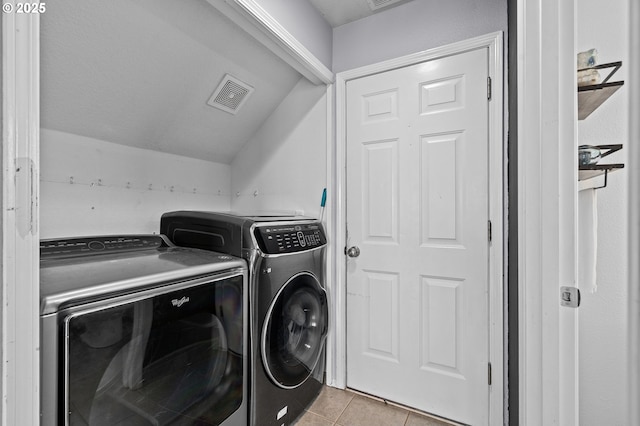 42015 NW Buckshire St, Banks, OR 97106 - washroom featuring visible vents, laundry area, light tile patterned floors, and washing machine and clothes dryer